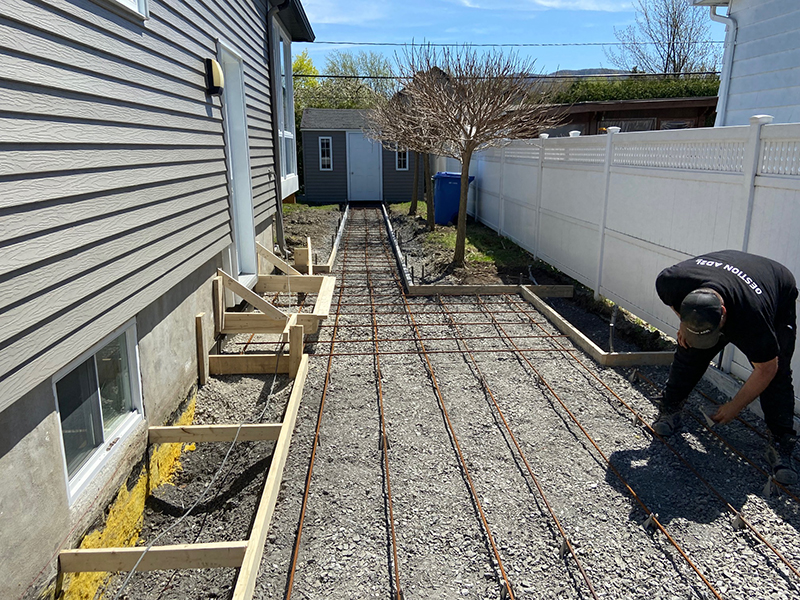 Coule et finition de beton residentiel a Longueuil - Travaux d'excavation, coffrage, installation d'armature, mise en place et finition de béton à Longueuil sur la rive-sud de Montréal